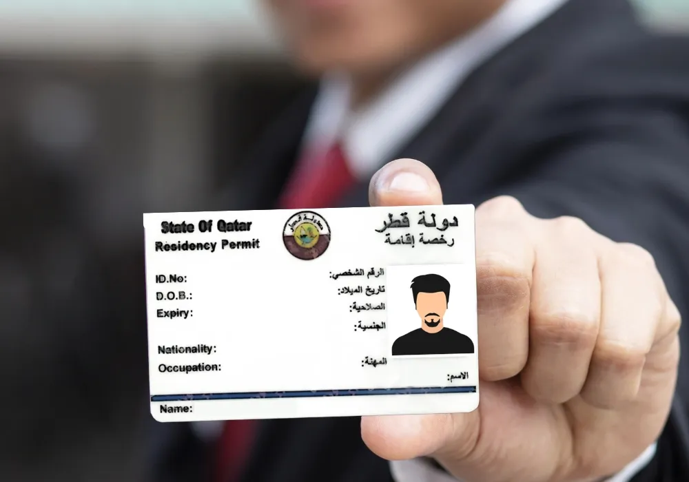 A resident undergoing Qatar ID biometrics fingerprinting at an MOI center